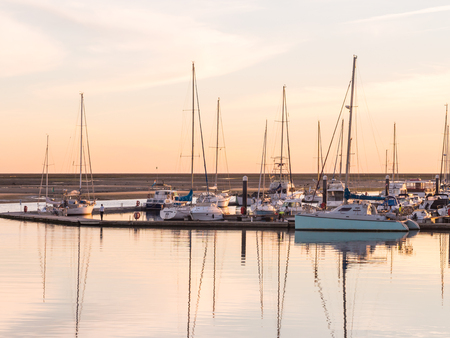 OLHAO, PORTUGAL - MARCH 28, 2018: Port in Olhao, Algarve region in south of Portugal, at sunset.のeditorial素材