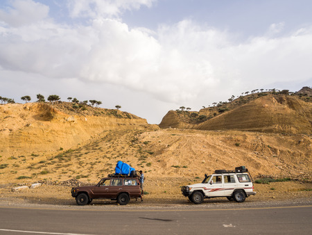 DANAKIL DEPRESSION, ETHIOPIA - JUNE 29, 2016: People traveling in jeeps in Danakil Depression, Ethiopia, the hottest place on Earth.のeditorial素材