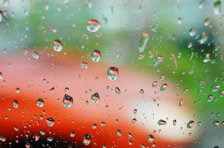 Rain drops on window in a rainy day.の写真素材