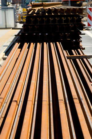Rusty rails lying on the construction site.