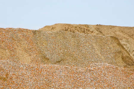 Piles of crashed rock at gravel pit.の写真素材