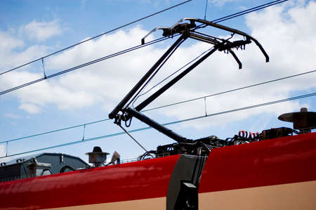 Pantograph on the train carriage roof top.の写真素材