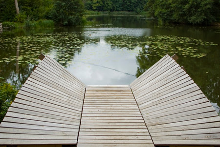 Lakeside with wooden modern deck.