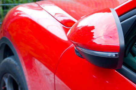Close up of red car wing mirror.の写真素材
