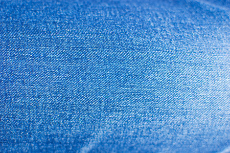 Faded blue jeans details background.の写真素材