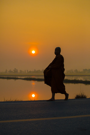 monk walking in the morningの写真素材