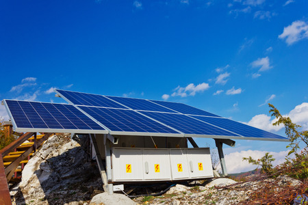 A roof with solar panels cells - detail  Solar panels producing clean and sustainable electricity ...