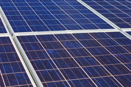 A roof with solar panels cells - detail  Solar panels producing clean and sustainable electricity ...