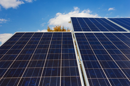 A roof with solar panels cells - detail  Solar panels producing clean and sustainable electricity ...