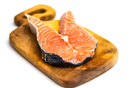Raw Salmon Red Fish Steak with Herbs and Lemon on White