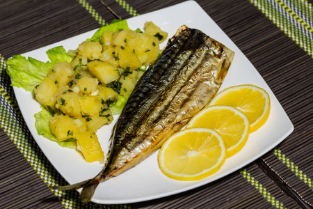 Fresh mackerel fillet with boiled potato and lemonの写真素材