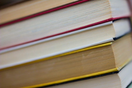 Closeup of stacked old books and textbookの写真素材