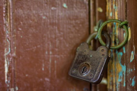 Old rusty lock on the wooden gateの写真素材