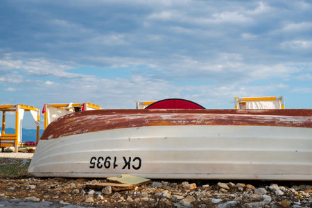 Abandoned fishing boat on the beachの写真素材