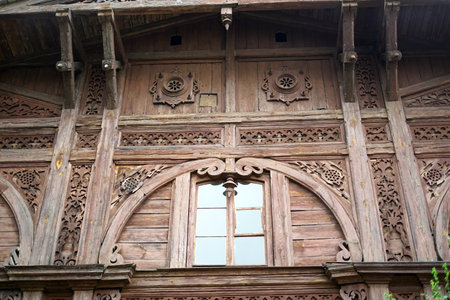Wooden window and wall of the old wooden house in Khajuraho, Indiaの写真素材
