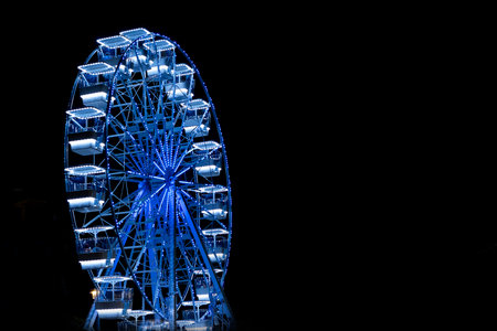 Ferris wheel in the park at night, closeup of photoの写真素材