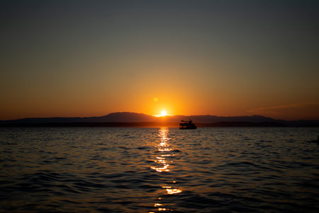 Beautiful sunset over the sea. The sun sets over the sea.の写真素材