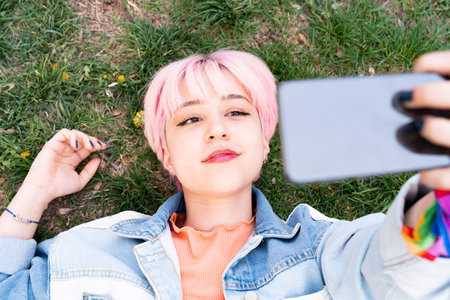 Happy young woman taking selfie