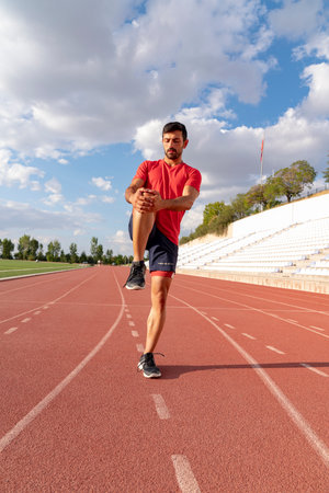 Athlete warming up by stretching before exercise. man doing stretching exercises before exercise