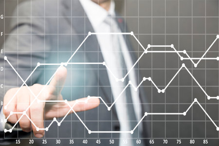 A businessman in a suit touches a virtual chart on a digital screen. finance money and chart