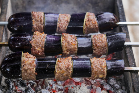 Eggplant kebab to barbecue. shish kebab cooked over coal fireの写真素材