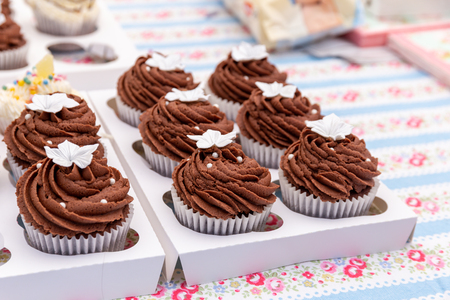 Homemade chocolate cupcakes on a market stallの写真素材