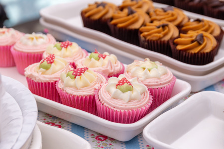 Homemade strawberry cupcakes on a market stallの写真素材
