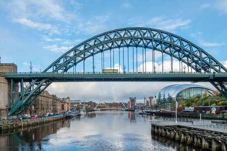 NEWCASTLE UPON TYNE, UK - NOVEMBER 08 2019: Tyne Bridge over the River Tyne, Newcastle, UK with Gateshead Sage building and the Gateshead Millennium Bridge in the backgroundのeditorial素材