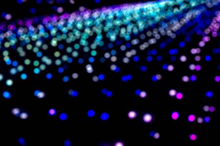 Colorful blurred, bokeh Christmas lights background imageの写真素材