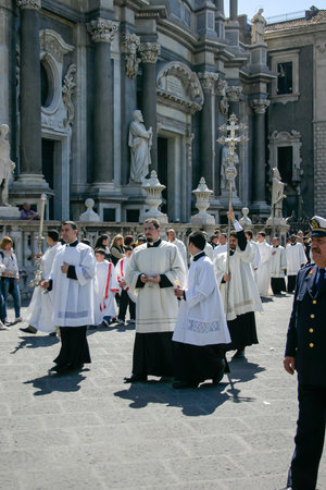 Catania, Italy - April 05 2007: Maundy Thursday procession in Piazza del Duomo, near the Catania Cathedral or Duomo. The Baroque style building is dedicated to Saint Agatha and was rebuilt in the 18th century after the 1693 earthquake.のeditorial素材