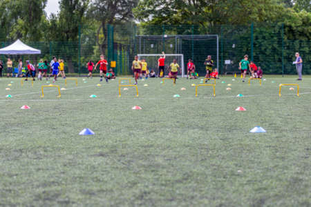 Children competing during school sports day in the UK. Blurred image with selective focus.の写真素材