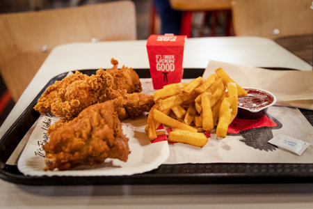 London, England - October 13 2021: KFC Mighty Bucket for One meal with additional chicken popcornのeditorial素材