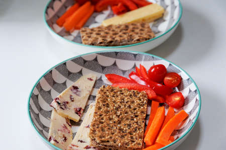 Healthy Rye crispbreads, vegetables and cheese in a bowl