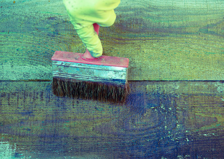 painting the old Board with a brushの写真素材