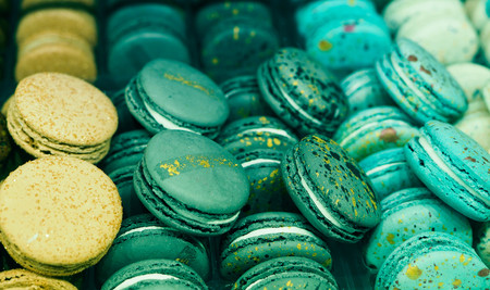 bright cakes and macaroons in the bakery window