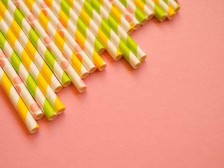 bright paper straws on a bright background . Summer backgroundの写真素材