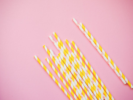 bright paper straws on a bright background . Summer backgroundの写真素材