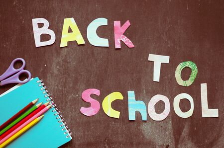 the writing paper back to school on chalk blackboard background