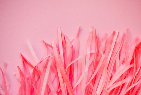 abstract background pink paper bundle on a pink backgroundの写真素材