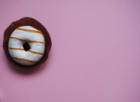 glazed donut lies on a monophonic backgroundの写真素材
