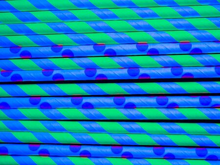 bright paper straws for a cocktail on a bright background . Summer backgroundの写真素材