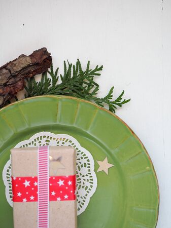 Christmas composition of spruce branches and stars on a white background minimalismの写真素材
