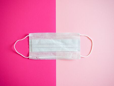 medical protective masks against coronavirus on a colored backgroundの写真素材