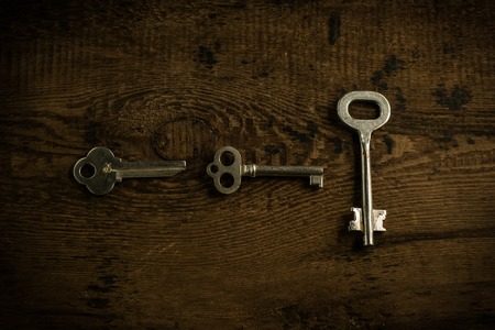 Set of keys on wood background photoの写真素材