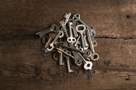 Set of keys on wood background photoの写真素材