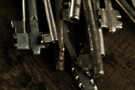 Set of keys on wood background photo