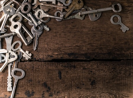 Set of keys on wood background photoの写真素材