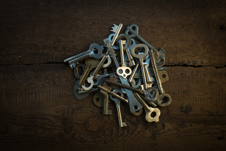 Set of keys on wood background photoの写真素材