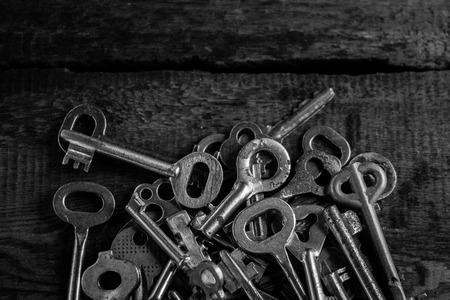 Set of keys on wood background photoの写真素材