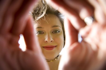 Young Woman Smiling Under The Sunの写真素材